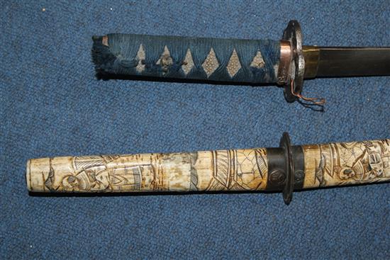 An early 20th century Japanese bone wakizashi and another